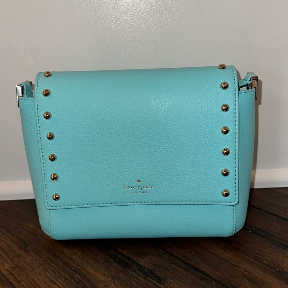 Blue Kate Spade crossbody with gold accents